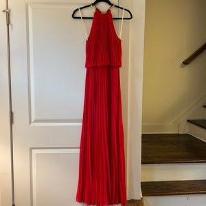 Stunning long red pleated gown. Halter top with gold ring. Size 4. Amazing!